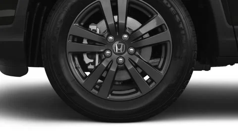 Car wheel close up Night Hawk Black Pearl 2020 Honda Ridgeline Sport pickup crew Stock Footage 160110122