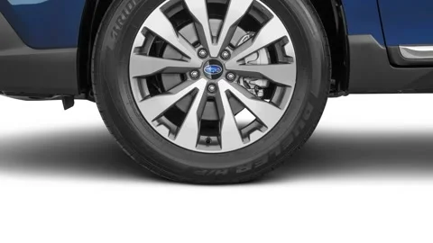 Car wheel close up side view Dark Blue Metallic 2018 Subaru Outback 3.6R Touring Stock Footage 159937681
