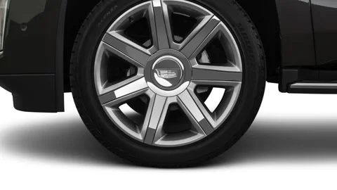 Car wheel close up side view Dark Granite Metallic 2018 Cadillac Escalade Luxury Stock Footage 159980199