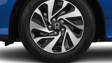 Car wheel close up side view Aegean Blue Metallic 2019 Honda Civic Hatchback LX Stock Footage 160082192