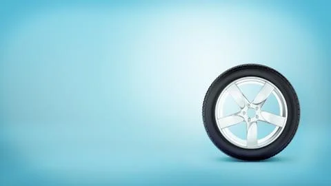 A car wheel with five spokes standing on the tire rim on blue background. 스톡 일러스트