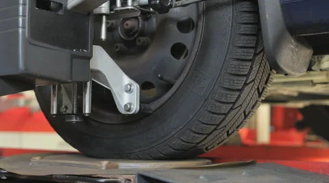 Car wheel fixed with computerized wheel alignment machine Stock Footage 51971155