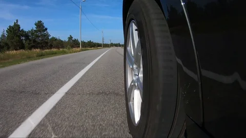 Car wheel in motion close-up Stock Footage 129058308