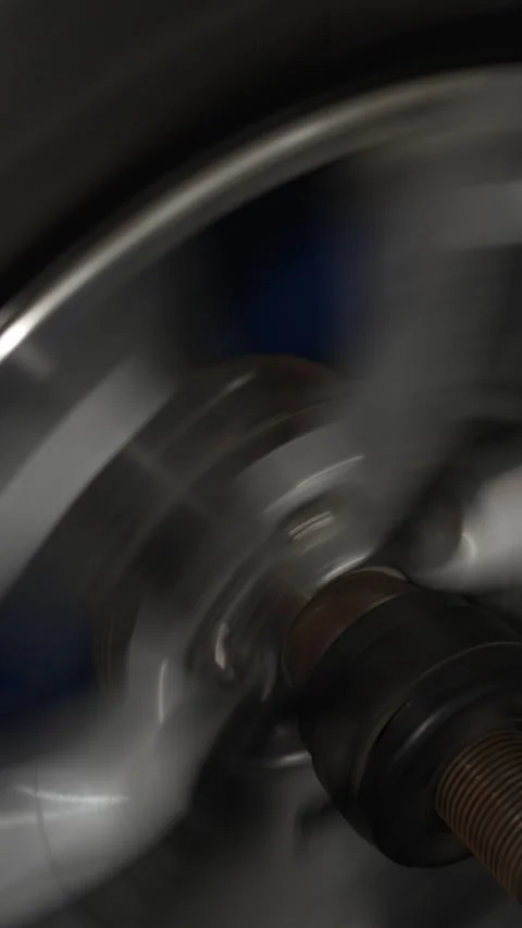 A car wheel mounted on a balancing machine in garage. Stock Footage 340977488