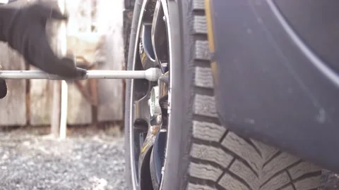 Car wheel replacement. Self-service tire fitting concept Stock Footage 153084748