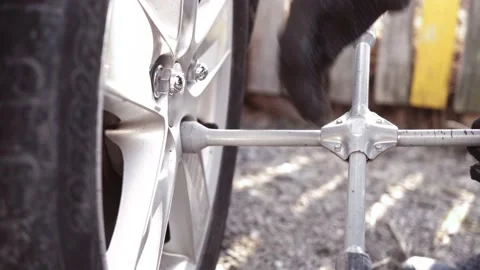 Car wheel replacement. Self-service tire fitting concept Stock Footage 153084772