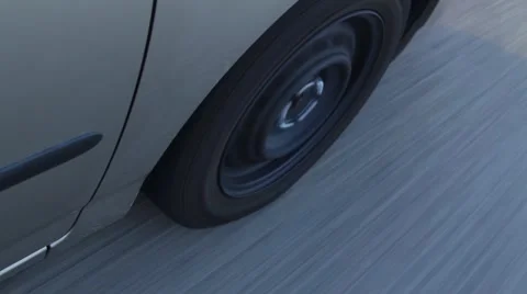 Car Wheel Rolling Down the Road Видео 45670310