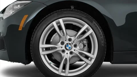 Car wheel side view Black Sapphire Metallic 2016 BMW 3-series 328i xDrive Stock Footage 159857464