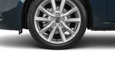 Car wheel side view Deep Crystal Blue Mica 2017 Mazda MAZDA3 Touring 2.5 Stock Footage 159931644