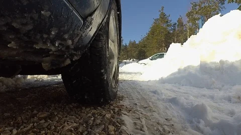 Car wheel in snow Stock Footage 129165912