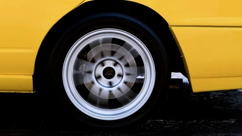 Car wheel spinning and creating of smoke, Drag racing car burns rubber, Vidéo 85637656