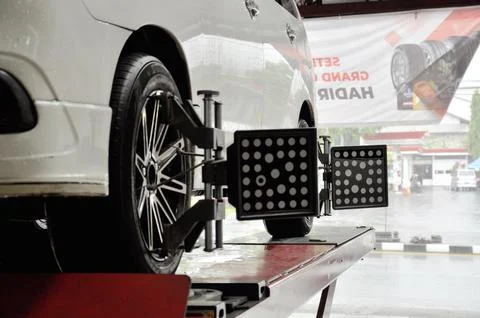 Car wheels installed wheel alignment sensor tool Stock Photos