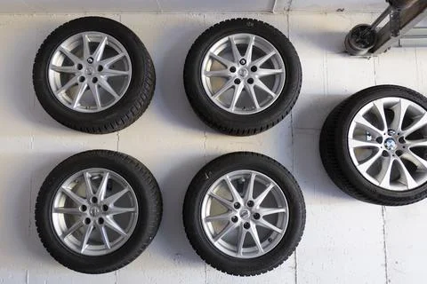 Car wheels on white wall Stock Photos