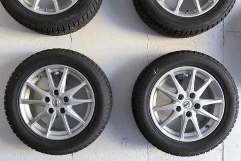 Car wheels on white wall Stock Photos