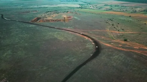 The car will go off-road at high speed. It flies off dirt and a lot of dust. Ral Stock Footage 173944885