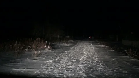 The car will go on the road at night in winter. people go front view  Stock Footage 58498967
