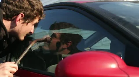 Car window busted open with tire iron Stock-Footage 14610662