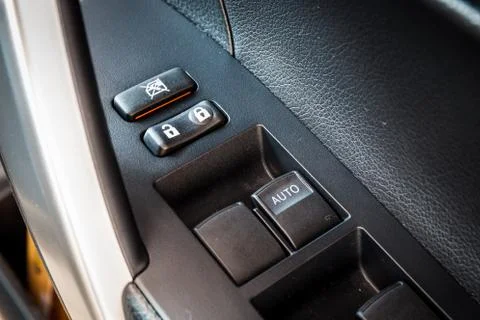 Car window control and adjustment buttons. Focus lock and unlock button Stock Photos