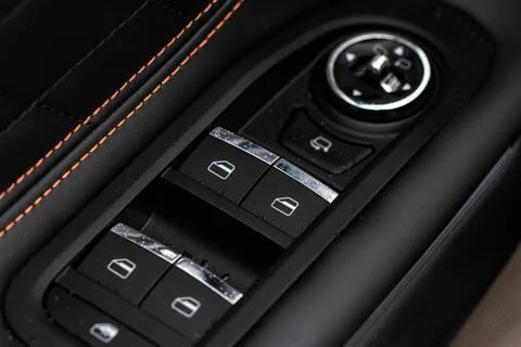 Car window control panel. Automatic power window up and down button. Photos