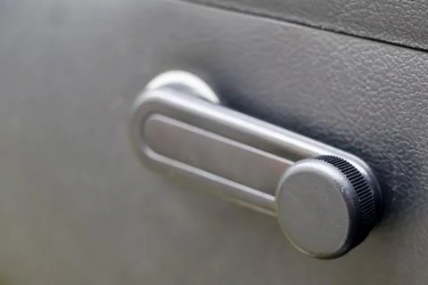 Car Window Crank Handle Inside Vehicle. Stock Photos
