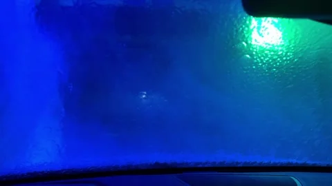 A car window is fogged up and the inside of the car is lit up with green lights 스톡 동영상 270058468