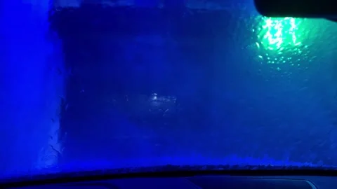 A car window is fogged up and the inside of the car is lit up with green lights Vidéo 270742127