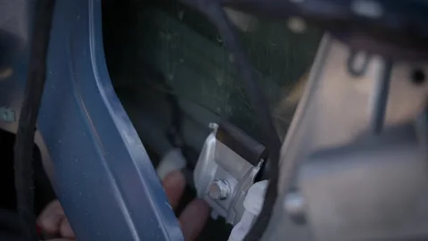 Car window glass slides into roll-up mechanism. Video stock 220181064