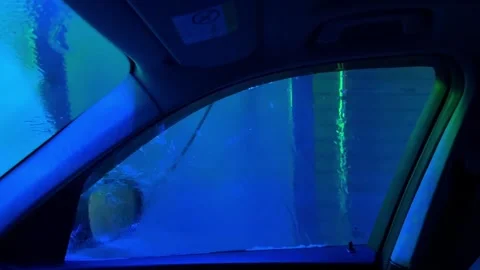A car window is lit up green 스톡 동영상 273445212