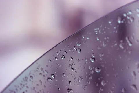 A car window lowered with raindrops on it. Travel in rainy weather, autumn, fall Stock Photos
