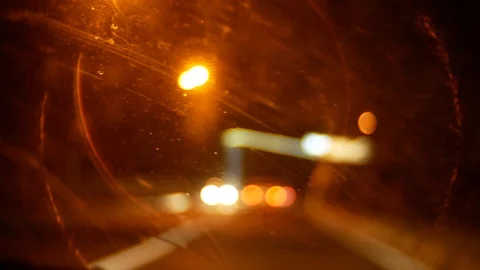 Car window night background defocus in motion, through the dirty window of the Видео 91211302
