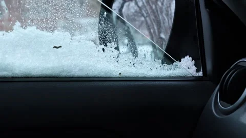 Car window opening during snowfall Stock Footage 345262640