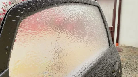 Car window opens and closes while thick ice layer stays intact Stock Footage 312236949