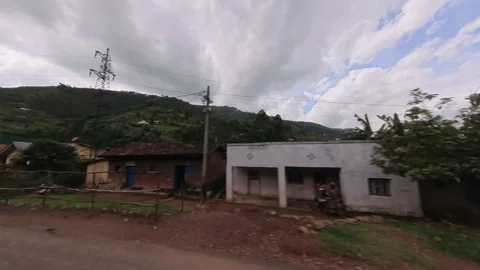 Car window perspective while driving in rural Rwanda Video stock 245134260