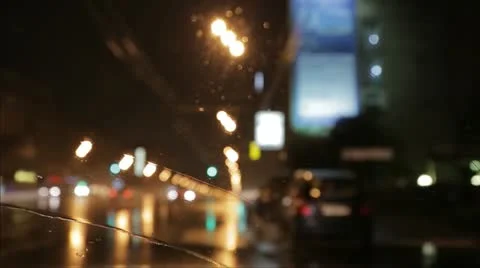 Car window rain night background defocused in motion Stock Footage 12457508