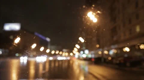 Car window rain night background defocused in motion time lapse Stock Footage 12472604