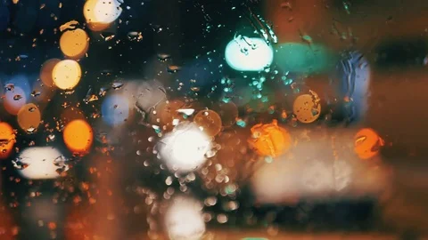 Car window rain night background defocused in motion Stock Footage 84762184
