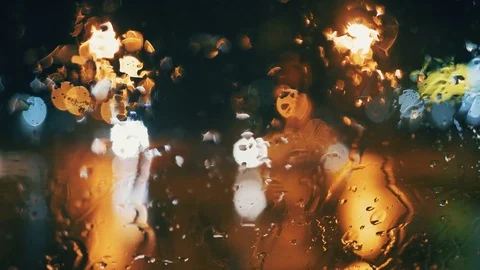 Car window rain night background defocused in motion Video stock 84762437