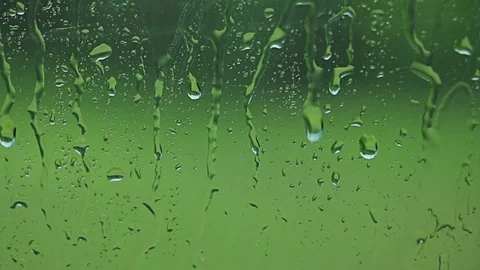 Car window Raining stormy day, rain drops flowing on window 動画素材 76642559