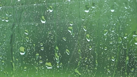 Car window Raining stormy day, rain drops flowing on window Stock Footage 76642701