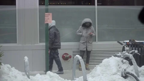 Car window rolling down man smoking cigarette winter snow day phone 4K NYC Stock Footage 75692884