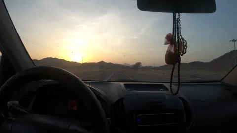 Car Window View of Arid Desert Hills at Dusk on Highway Vídeo Stock 320504851