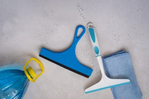 Car windows cleaning with microfiber and washing liquid. Stock Photos