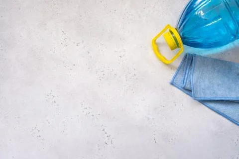 Car windows cleaning with microfiber and washing liquid. Stock Photos
