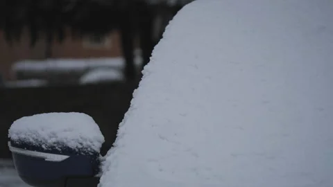 Car windscreen and rear mirror covered in snow. Stock Footage 228671534