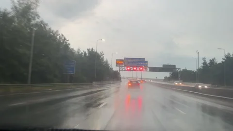 Car windscreen view driving Manchester orbital motorway M60 fire brigade truck 動画素材 309459359