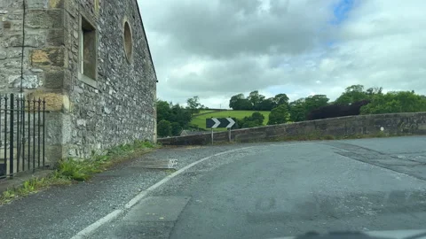Car windscreen view driving over the bridge in Sawley village, Lancashire. Vídeos de archivo 290887361