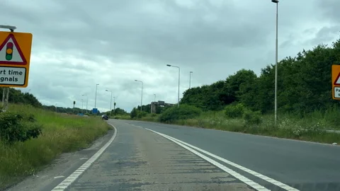 Car windscreen view driving slip road, joining motorway M6. 库存影片 302900261