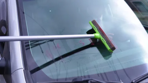 Car Windshield Being Cleaned - Close-up Exterior View 動画素材 288253862