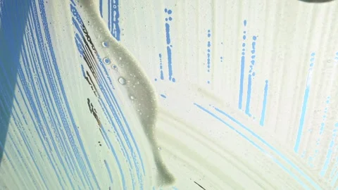 Car Windshield Being Washed with Brush and Soap Foam Stock Footage 329644412