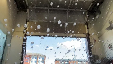Car Windshield Covered in Flowing Foam in Automatic Car Wash Stock Footage 333051000
